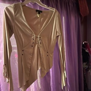Bebe shirt circa 2004 size small 94% polyester 6% spandex , it feels like suede